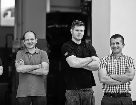 Group of mechanics with arms crossed